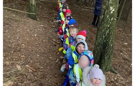 nursery children exploring the woods