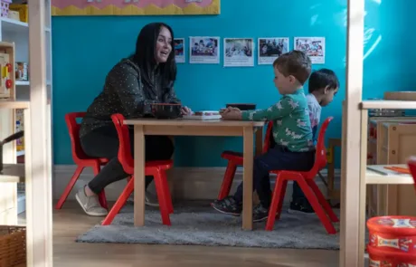Nicola Cooper with nursery child inside Preschool Room at Monkey Puzzle Altrincham